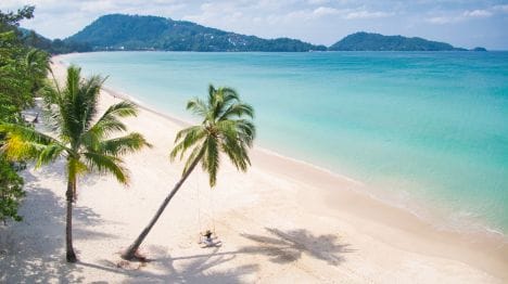 My-THAILAND-Aerial-view-of-Phuket-Beach-in-Thailand-with-woman-on-a-swinging-chair-attached-to-a-coconut-tree