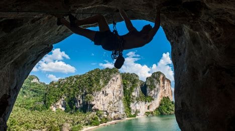 MY-THAILAND-Man-doing-rock-climbing-in-railay-beach-krabi