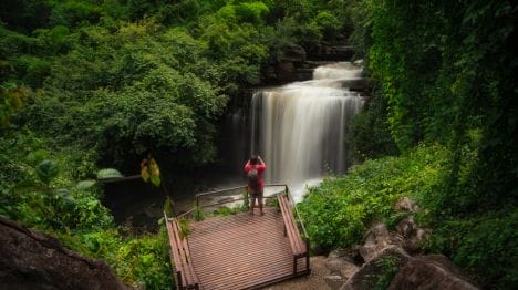 MY-THAILAND-Man-looking-at-Bang-Pae-Waterfall-in-Phuket